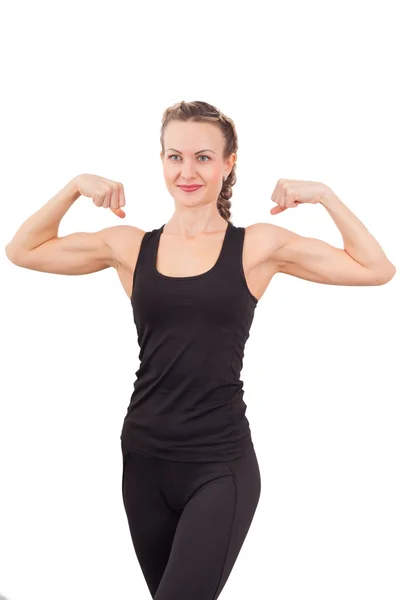 Atlético jovem mulher mostrando bíceps — Fotografia de Stock