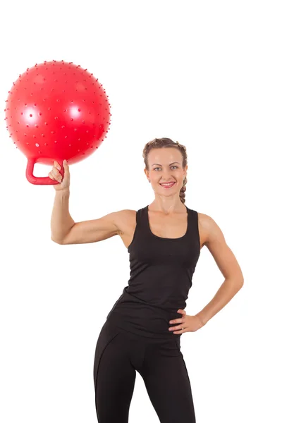 Atletica giovane donna con palla rossa — Foto Stock