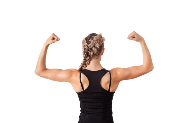 Athletic young woman showing biceps — Stock Photo, Image