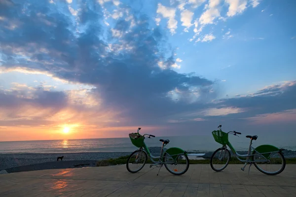 Two bicycles at sunset — Stock Photo, Image