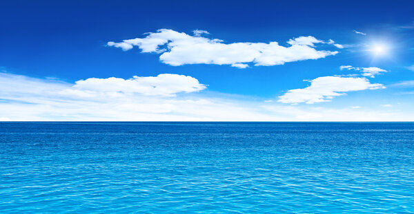 Cloudy sky, sea and sun