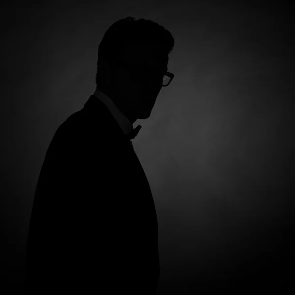 Silhouette of man on grey — Stock Photo, Image