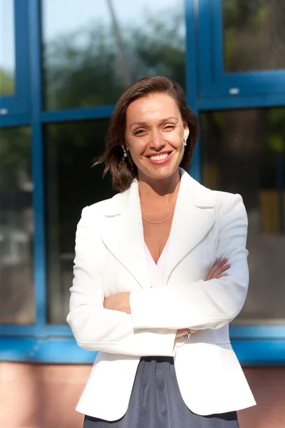 Beautiful businesswoman near office — Stock Photo, Image