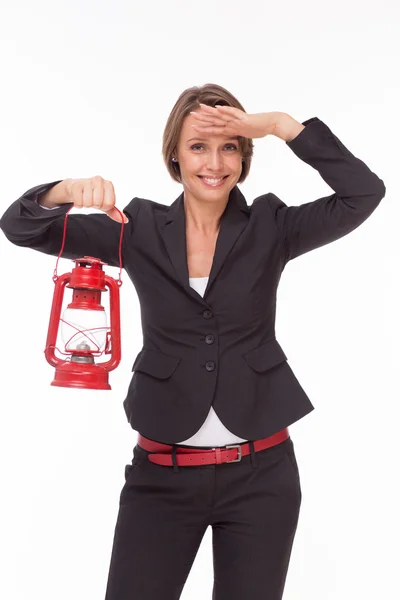 Mujer de negocios con lámpara de queroseno rojo — Foto de Stock