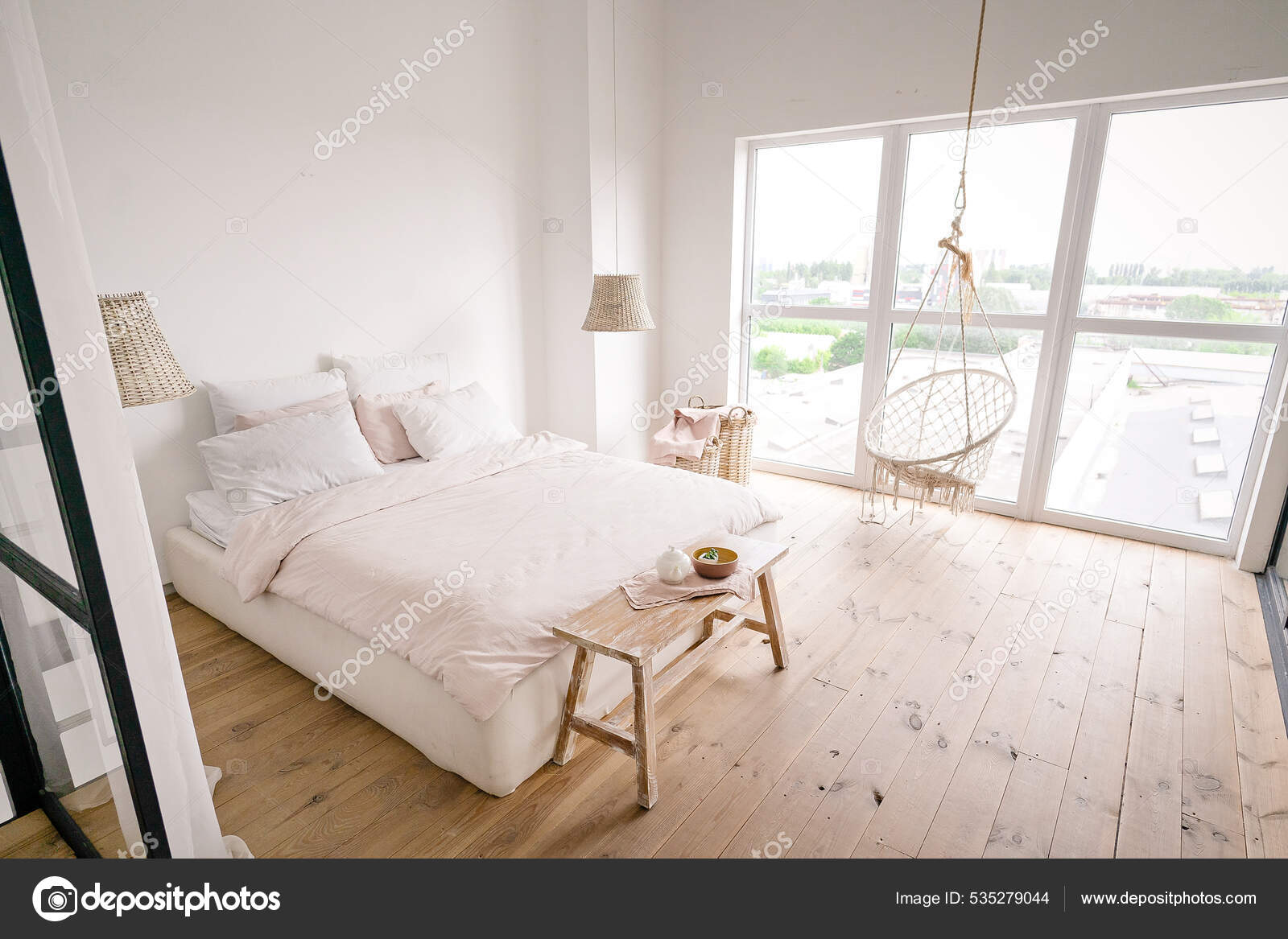 Large Bright Bedroom in a Minimalist Style in Pastel Cream Colors