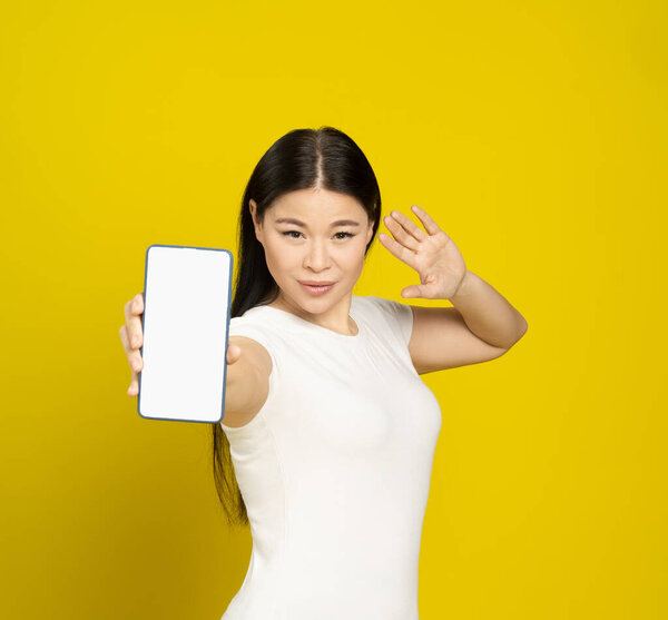 Confident Beautiful Asian Woman 40S Smiling Holding Smartphone Showing Blank Stock Photo