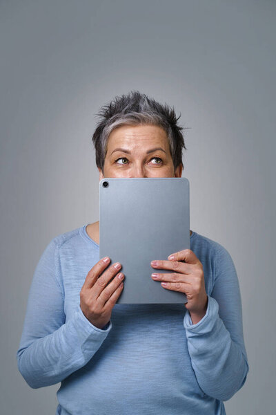 Grey Haired Mature Woman Scared Hide Face Digital Tablet Posting Stock Image