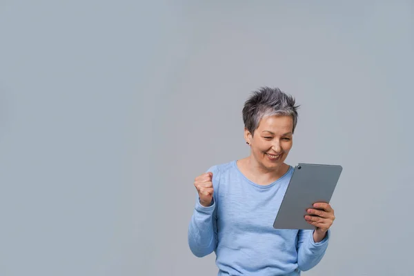 Excited Mature Woman Grey Hair Looking Tablet Shopping Working Online — Photo