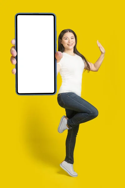 Happy Jump Middle Aged Asian Woman Showing Smartphone White Screen — Photo