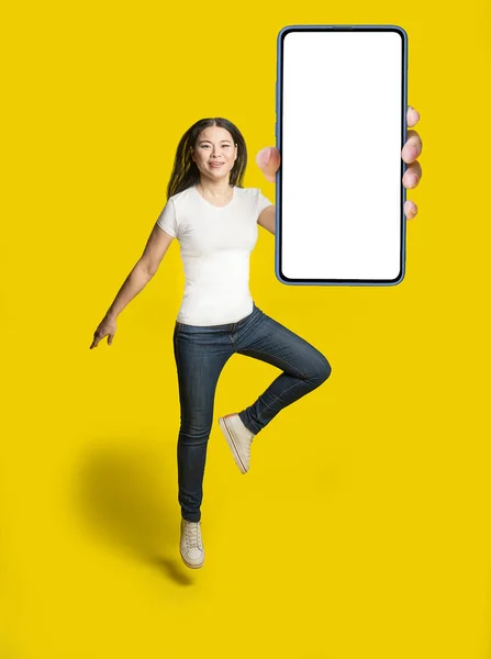 Middle Aged Asian Woman Freezed Jumping White Screen Smartphone Wearing — Photo
