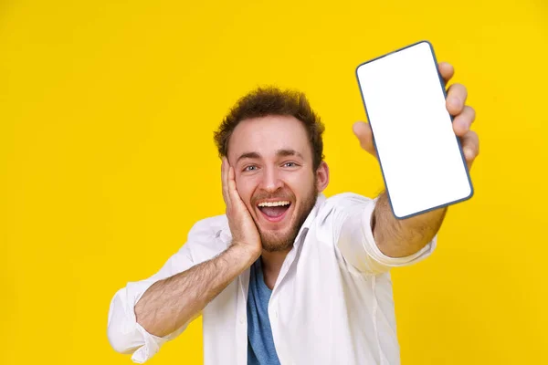 Great Offer Young Happy Man Holding Smartphone Showing White Empty — Photo