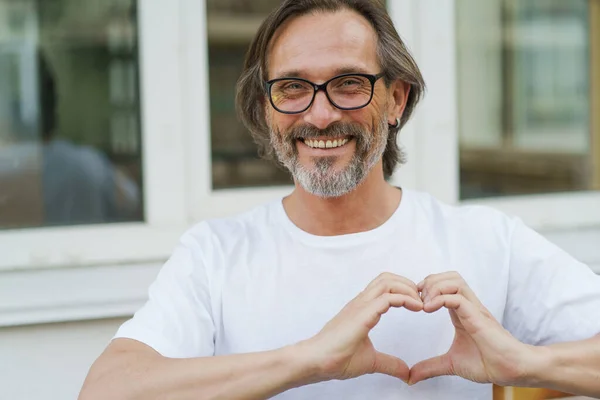 Gesturing Heart Love Happy Mature Man Glasses Smile Standing Outdoors — Stok Foto