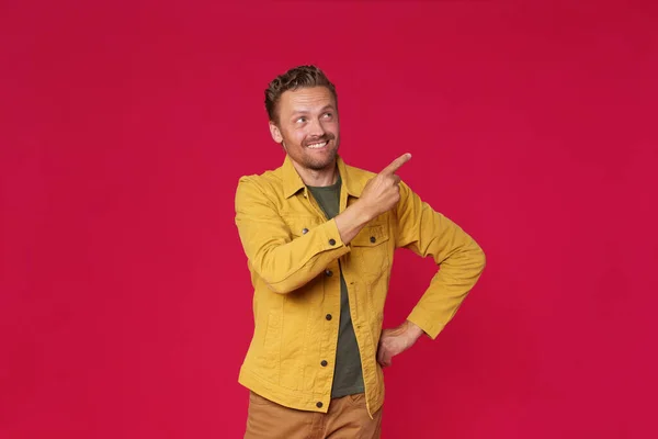 Handsome Young Man Jeans Jacket Pointing Looking Sideways Mock Advertisement — Stock Photo, Image