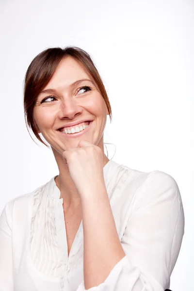 Thinking woman smiling looking up — Stock Photo, Image