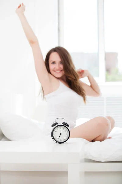 Woman waking up in bed — Stock Photo, Image