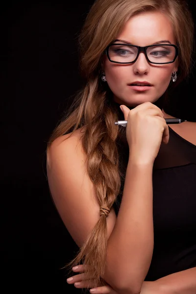 Woman thinking, planning with pen — Stock Photo, Image