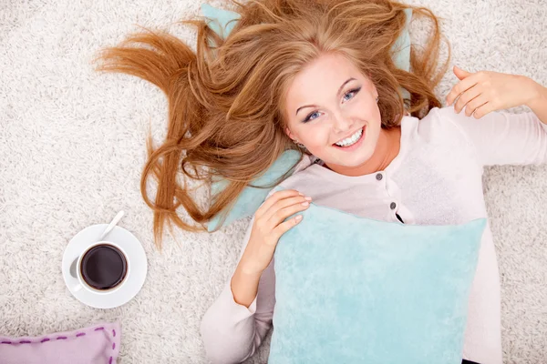 Woman lying with pillow — Stock Photo, Image