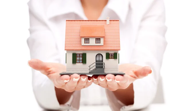 Small toy house in hands — Stock Photo, Image