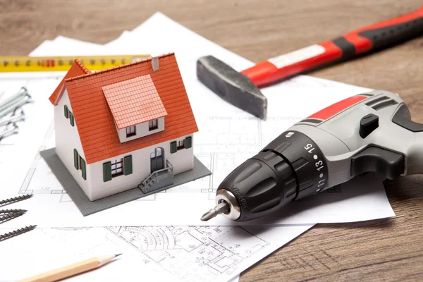 Scale model of house with tools — Stock Photo, Image