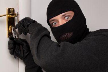 Thief Burglar opening door clipart