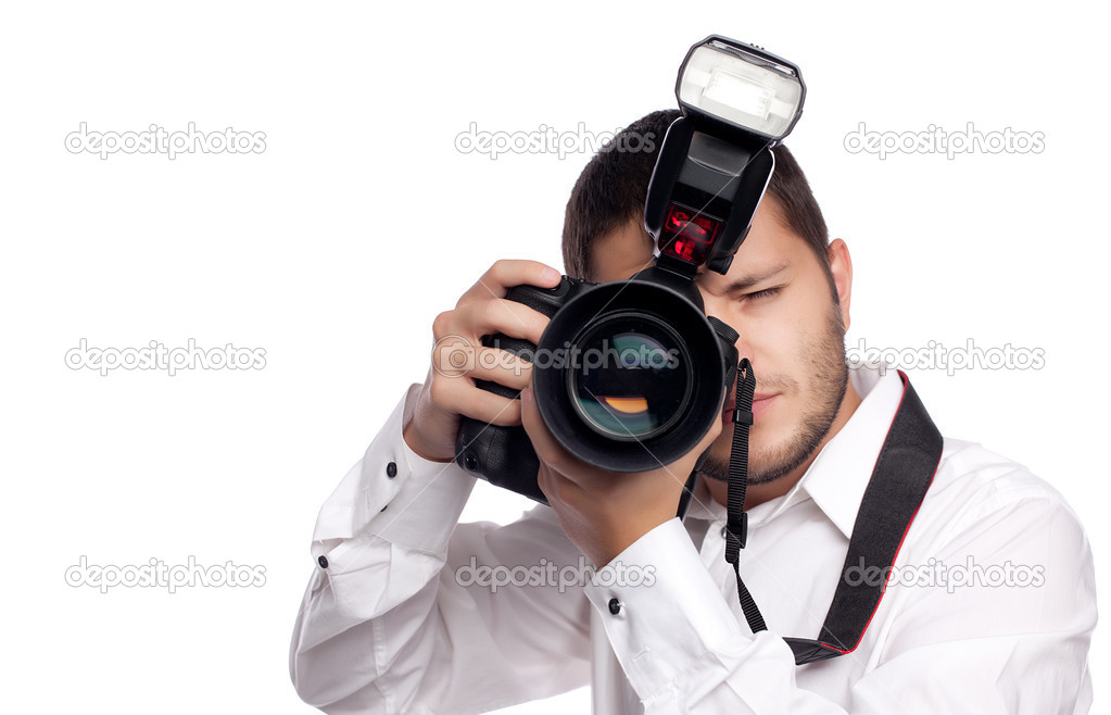 Young man taking photo with professional camera