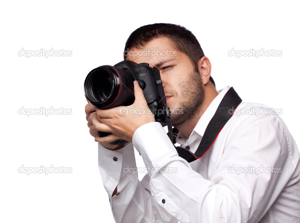 Young man taking photo with professional camera