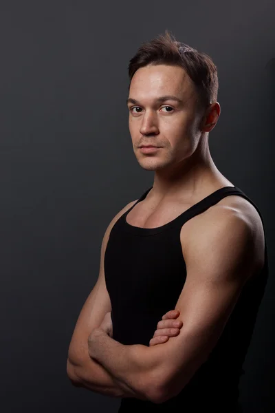 Young man with crossing arms — Stock Photo, Image