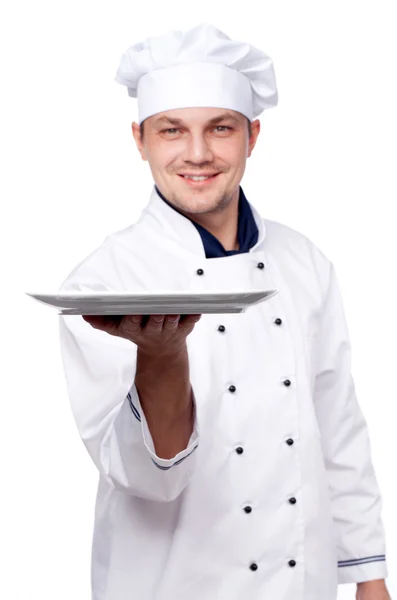 Chef holding empty plate — Stock Photo, Image