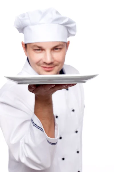 Chef holding empty plate — Stock Photo, Image