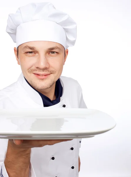 Chef holding empty plate — Stock Photo, Image