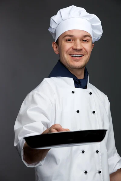 Chef holding pan — Stock Photo, Image