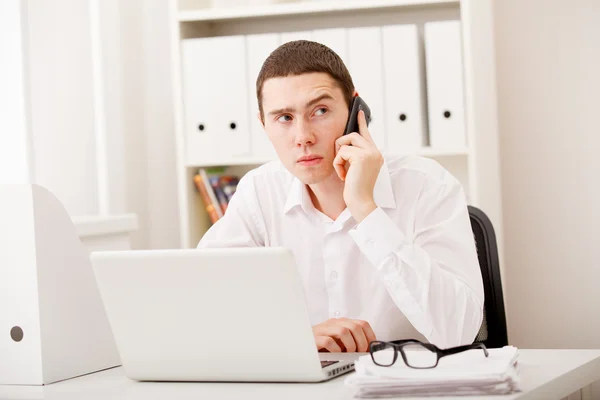 Businessman on phone sitting — Stock Photo, Image