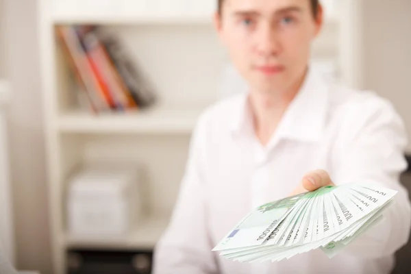 Euro in male hands — Stock Photo, Image