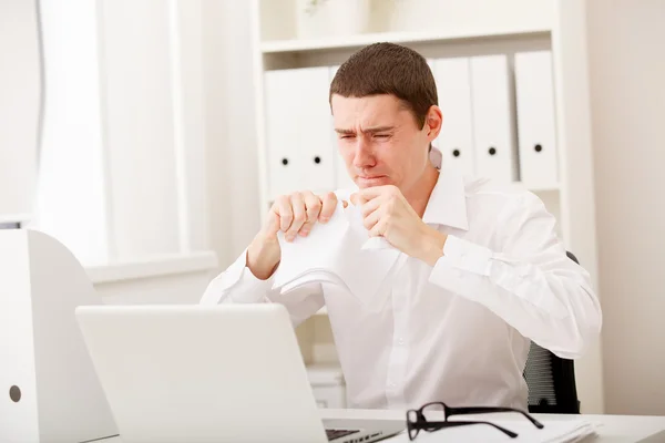 Angry man with document — Stock Photo, Image