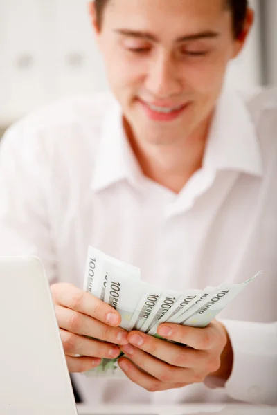 Businessman with cash — Stock Photo, Image