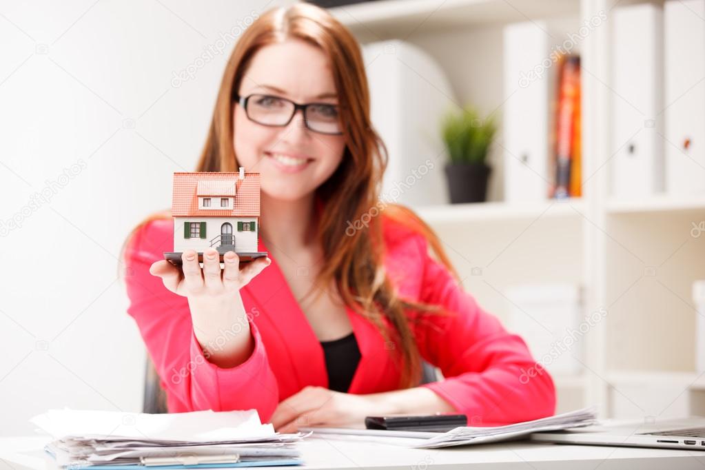 house in woman's hands