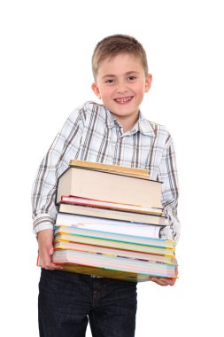 ellerinde ağır kitaplar büyük bir yığın ile oturmak.