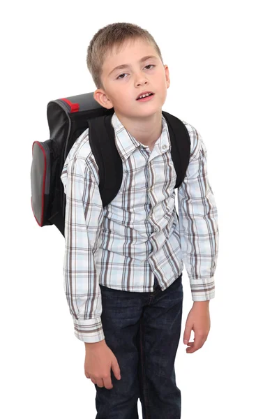 Schoolchild with a heavy satchel on shoulders. — Stock Photo, Image