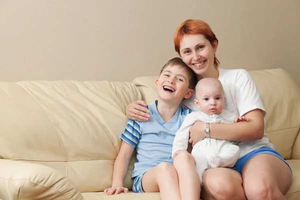Happy mother with two children. — Stock Photo, Image