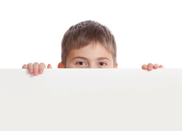 Boy emerge from behind poster — Stock Photo, Image