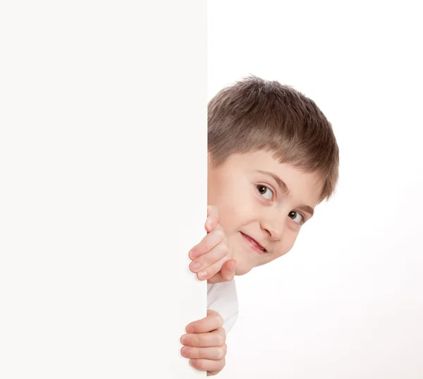 Boy look out through poster — Stock Photo, Image