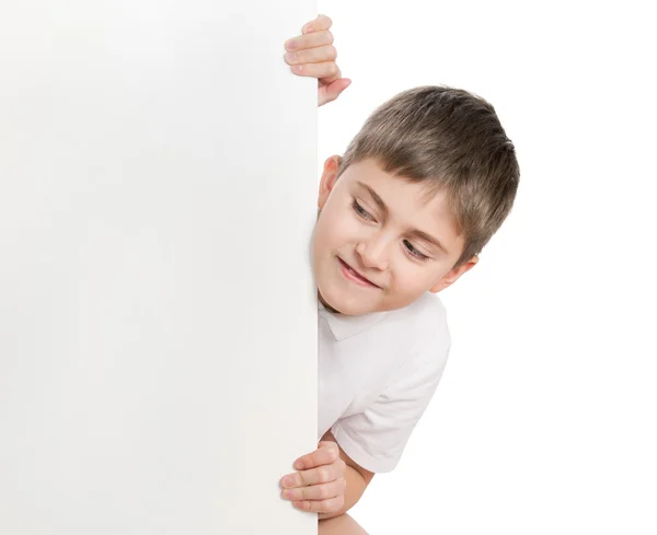 Boy peep out through poster Stock Photo