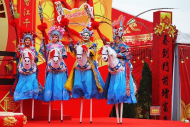 Beautiful dancers on stilts depict riders clipart