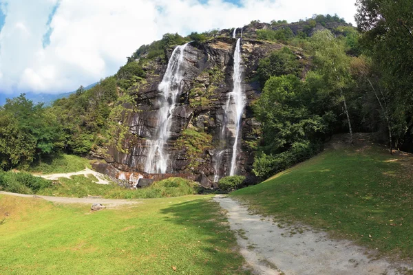 Parallel streams of water on a green hillside — Stock Photo, Image