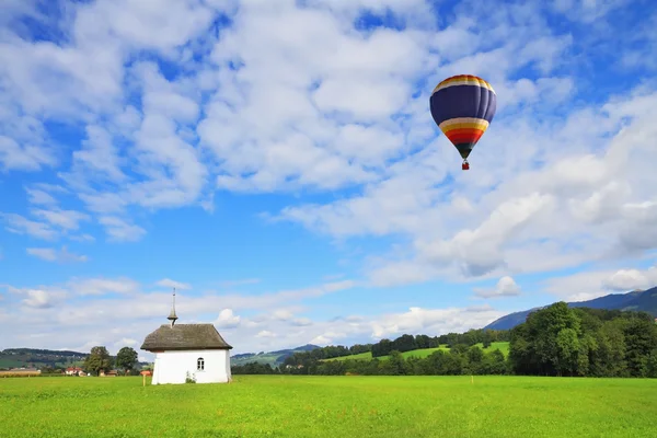Balloon over the lovely chapel — Stock Photo, Image