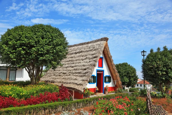 The cottage and gable small garden with flowers — Stok fotoğraf