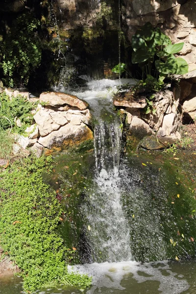 A small sunlit waterfall — Stock Photo, Image