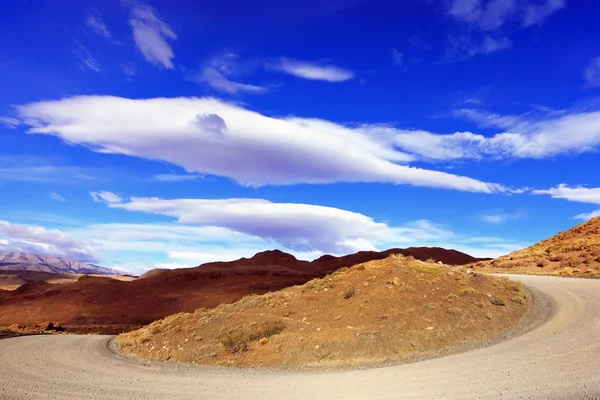 The dirt road under the fabulous clouds — Stock Photo, Image