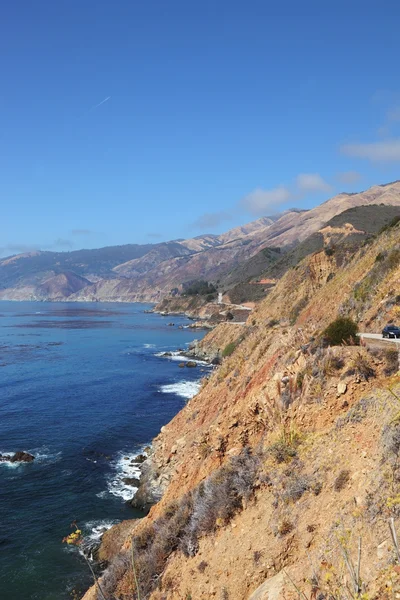 Azure ocean surf on the steep coast — Stock Photo, Image