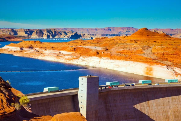 Glen Canyon Dam across the Colorado River to scenic red sandstone. Best journey in life. Glen Canyon Dam - located in Arizona, in the Grand Canyon Gorge. Concept of photo tourism